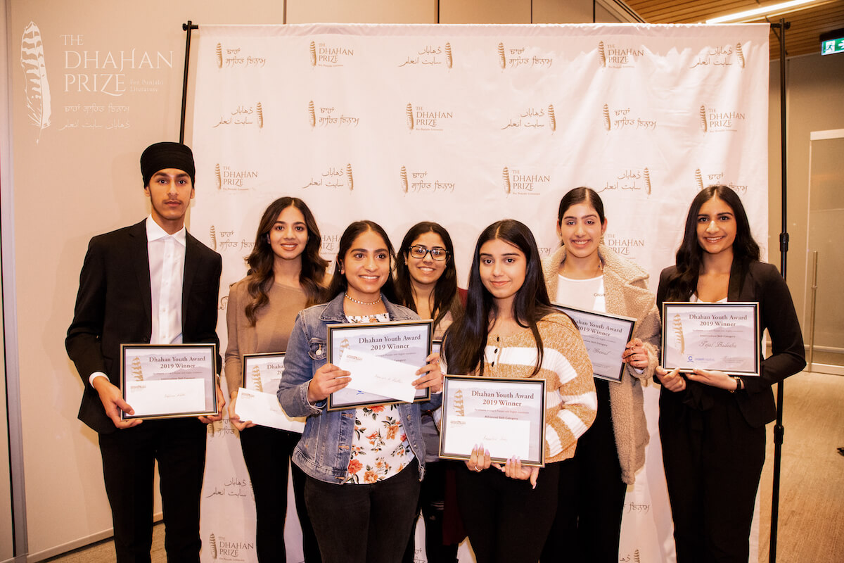 Dhahan Youth Awardees at 2019 event holding certificates and award cheques