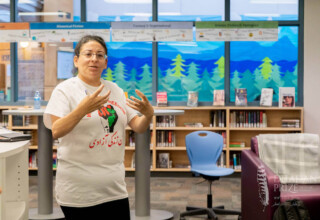 Annie Ohana, Indigenous Department Head at L.A. Matheson Secondary School, Surrey, British Columbia, Nov. 15, 2022 Teacher Annie Ohana speaking to audience of students at presentation with award winning Punjabi author