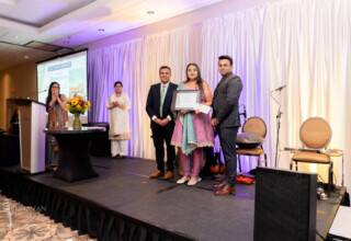 Dhahan Youth Award recipient at 2022 Dhahan Prize Ceremonies receiving certificate and cheque