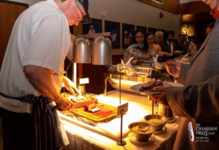 Cutting roast beef for the buffet at the 2023 Dhahan Prize Ceremonies